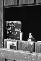 Minimalist illustration of handwashing steps with clear icons on a white background.
