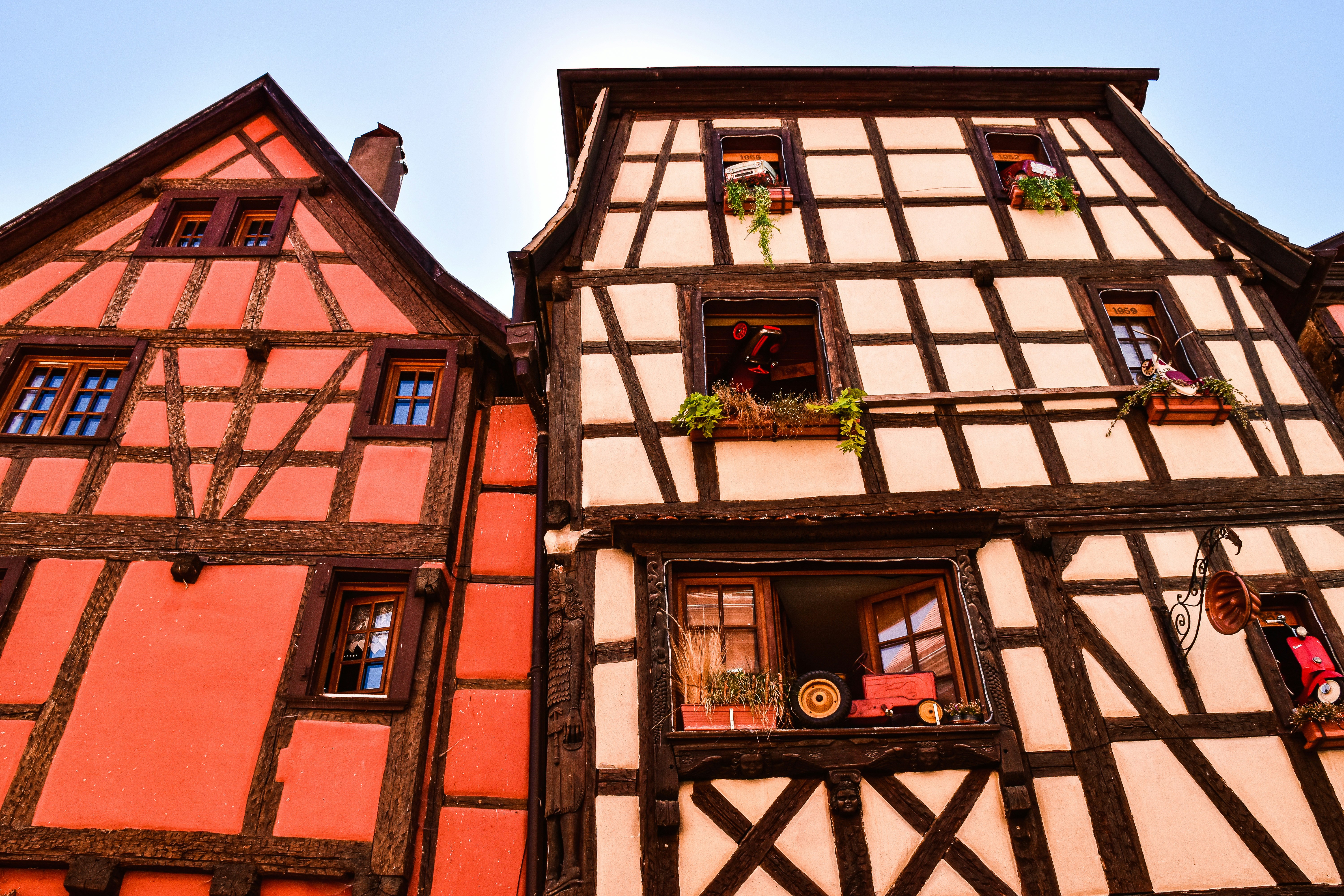 a tall building with a clock on the side of it, Alsace, France.