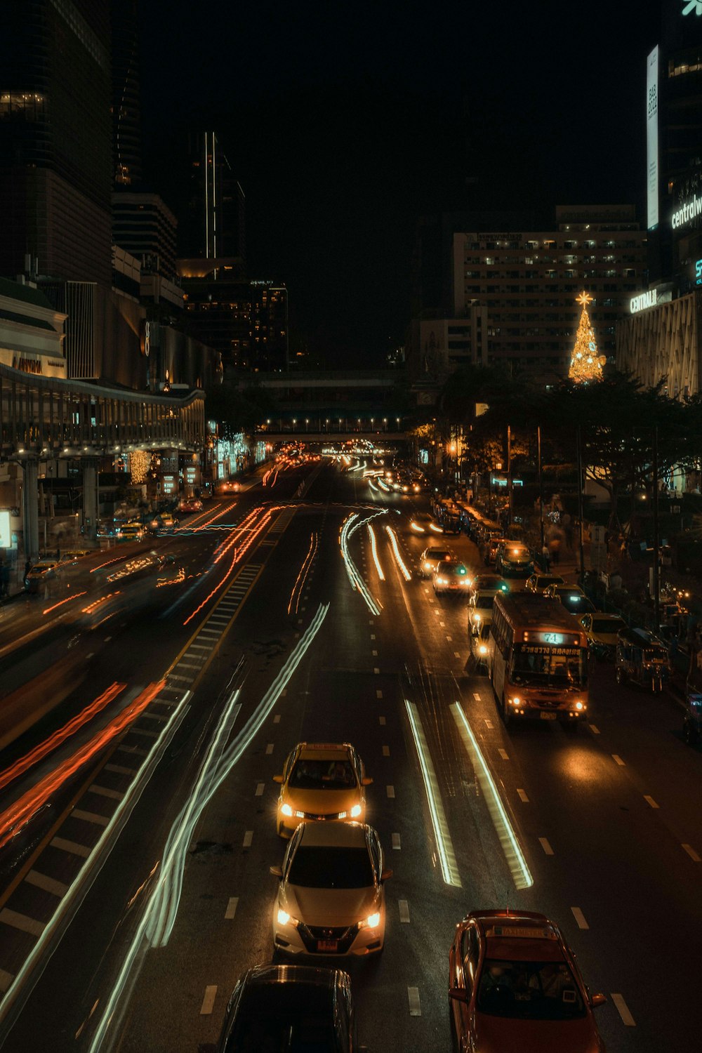 a city street filled with lots of traffic at night