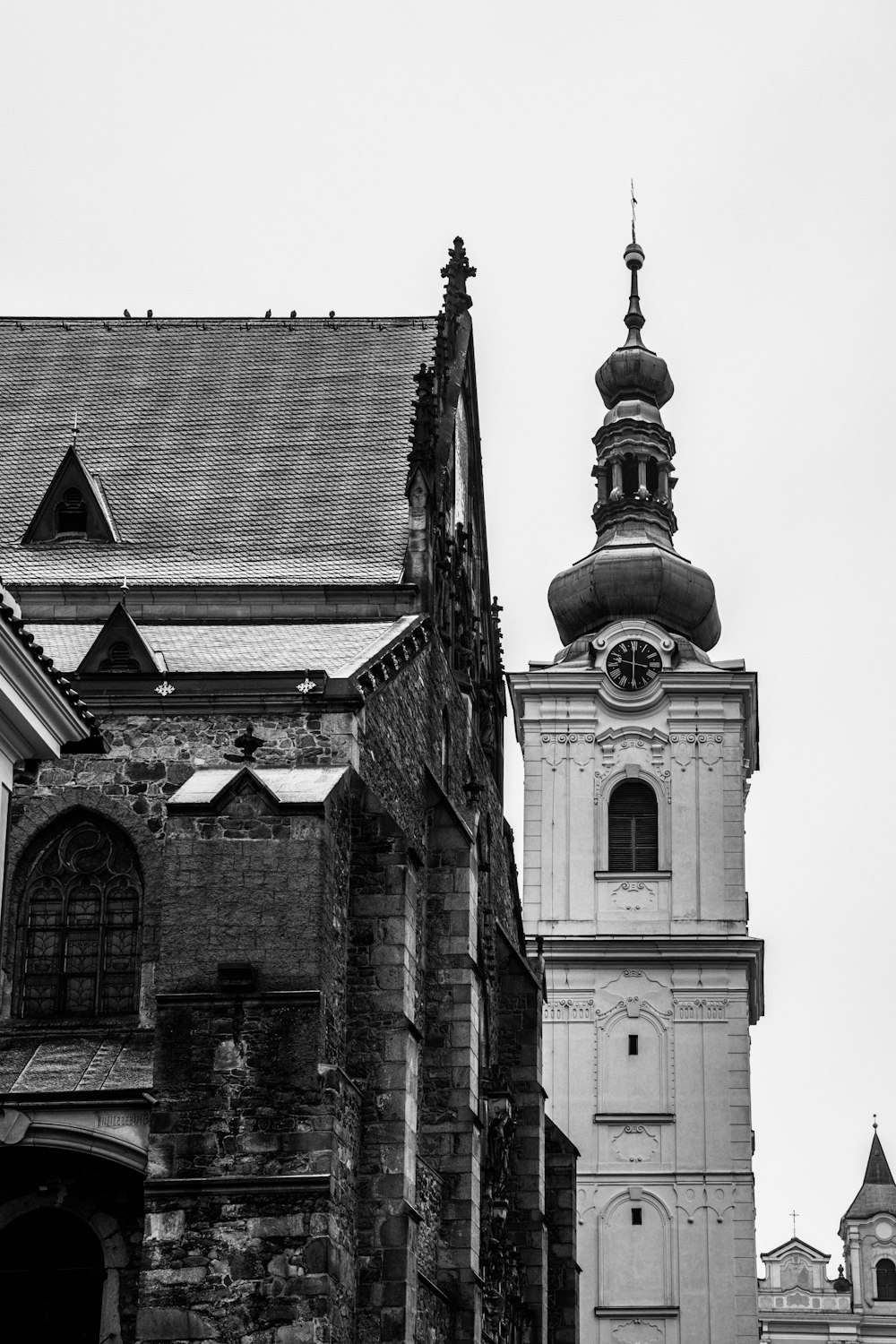 a black and white photo of an old church