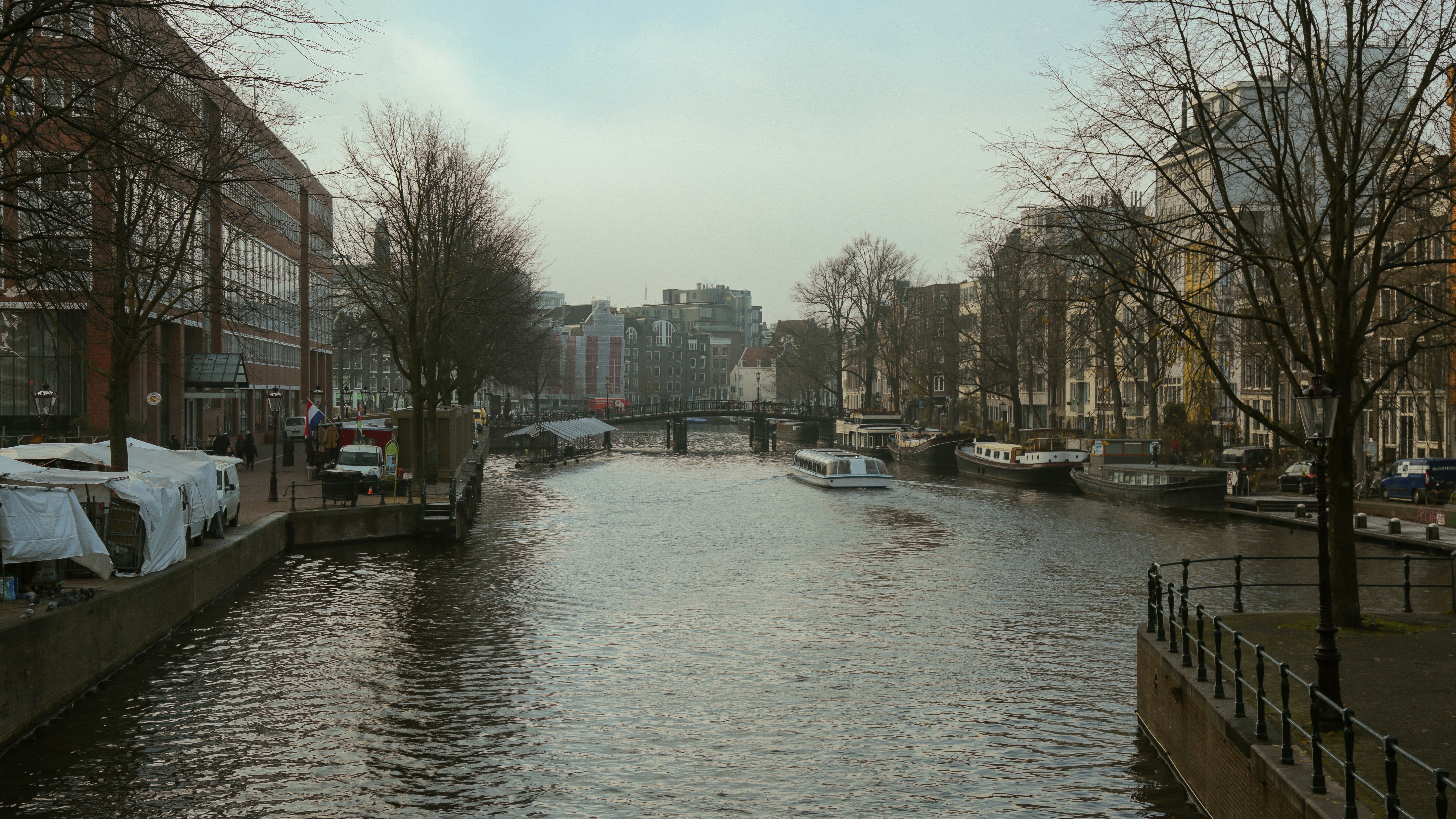 a river running through a city next to tall buildings