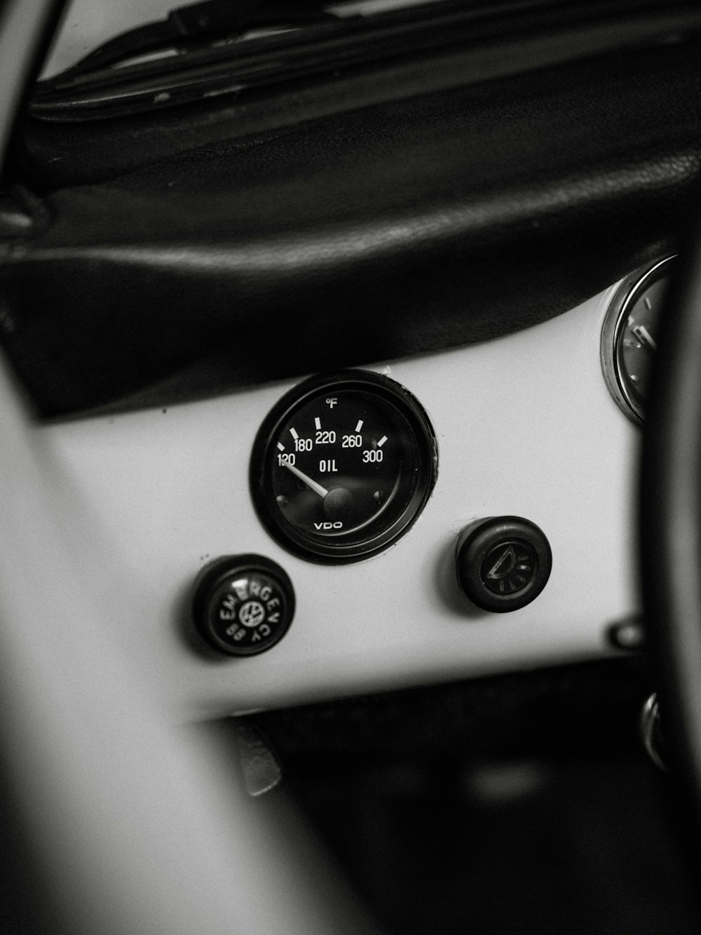 a black and white photo of a car dashboard