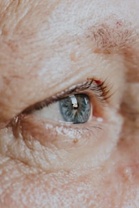 a close up of a person's blue eye