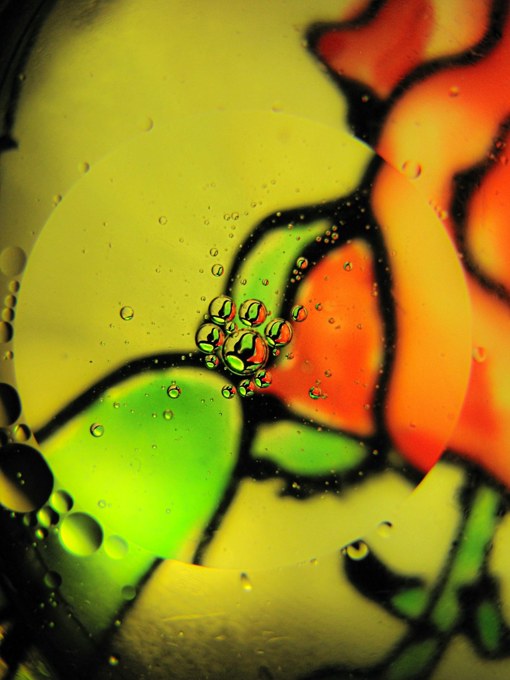 a close up of a glass with water drops on it