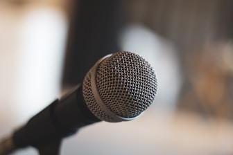 a close up of a microphone with a blurry background