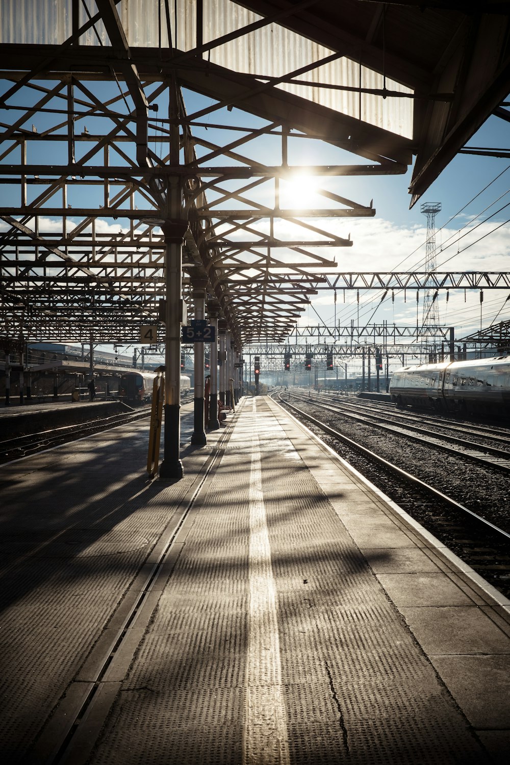 a train station with a train on the tracks