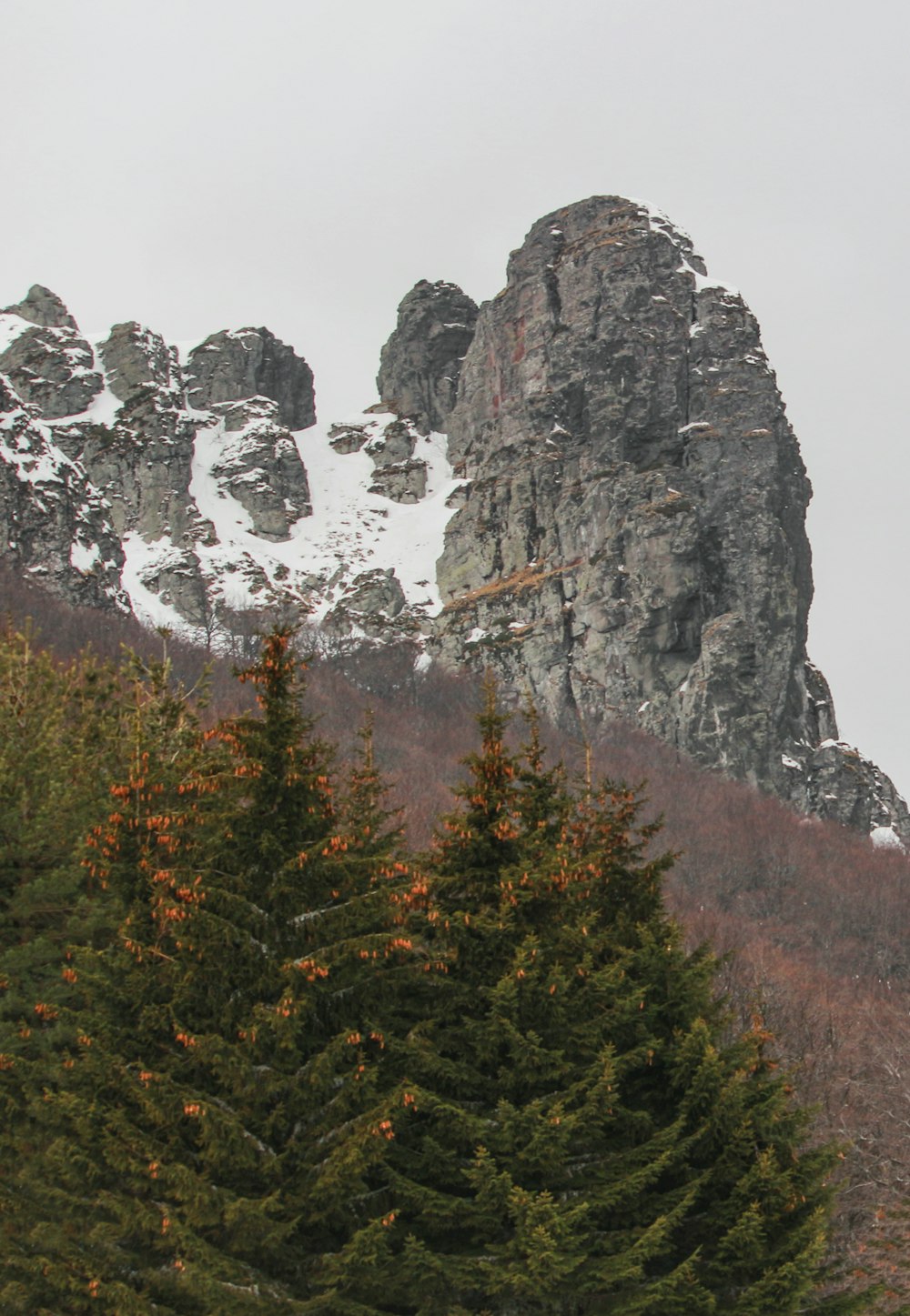 a tall mountain with snow on top of it