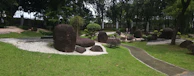 A peaceful garden with natural stones arranged for a geobiology consultation.