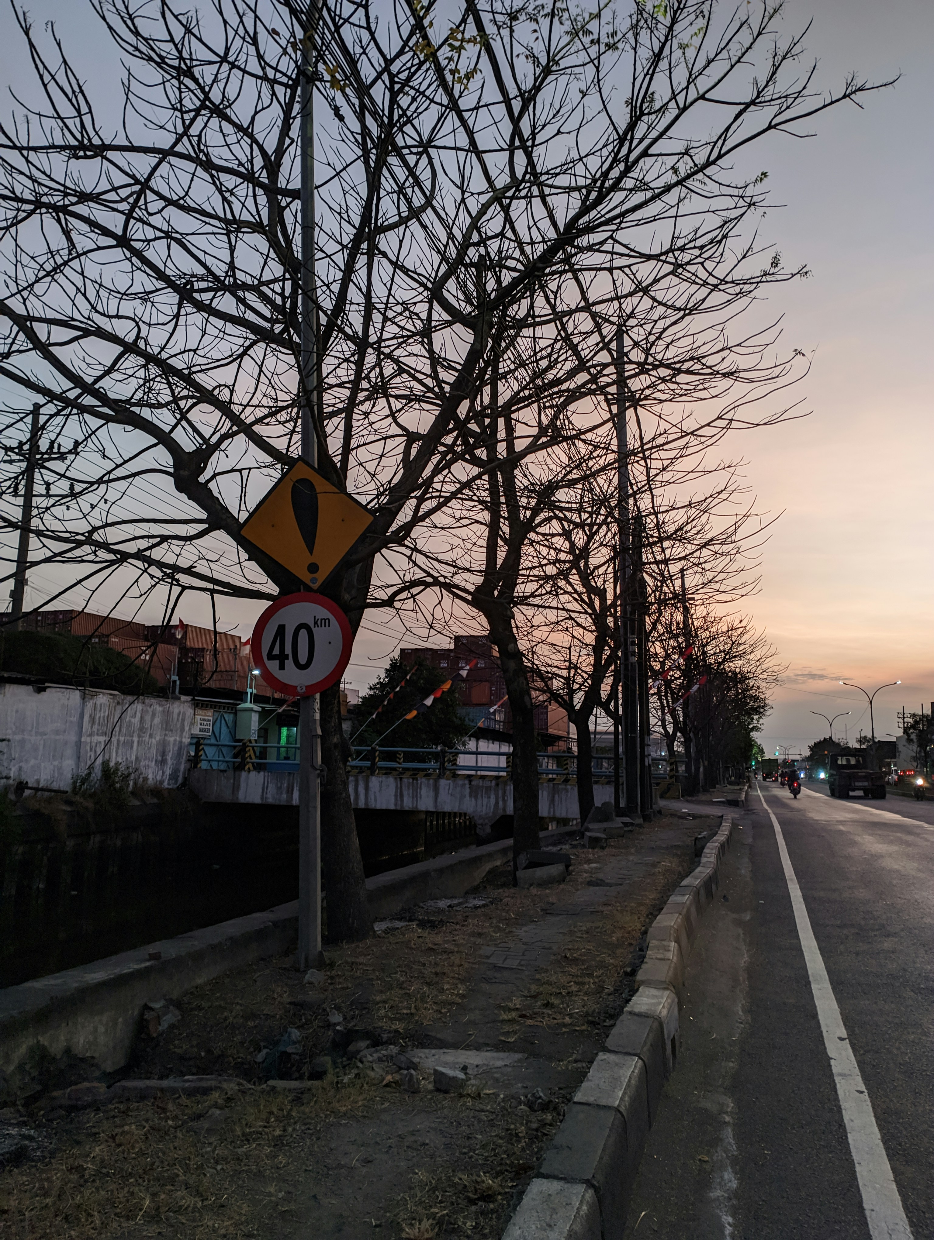 a street sign sitting on the side of a road