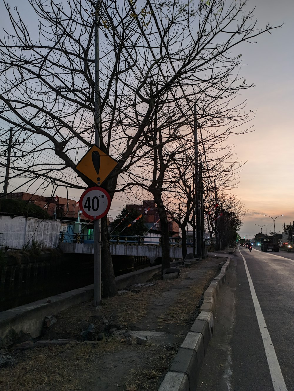 a street sign sitting on the side of a road