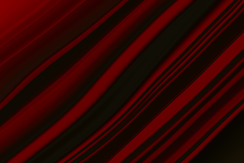 a close up of a red and black curtain