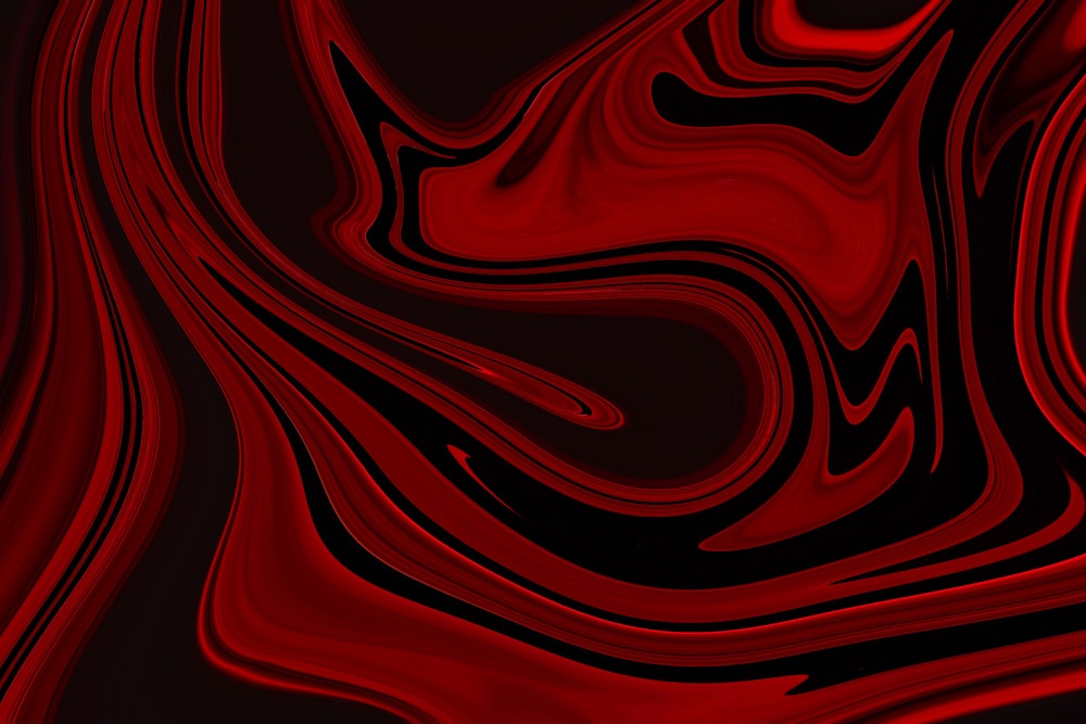 a red and black background with a wavy design