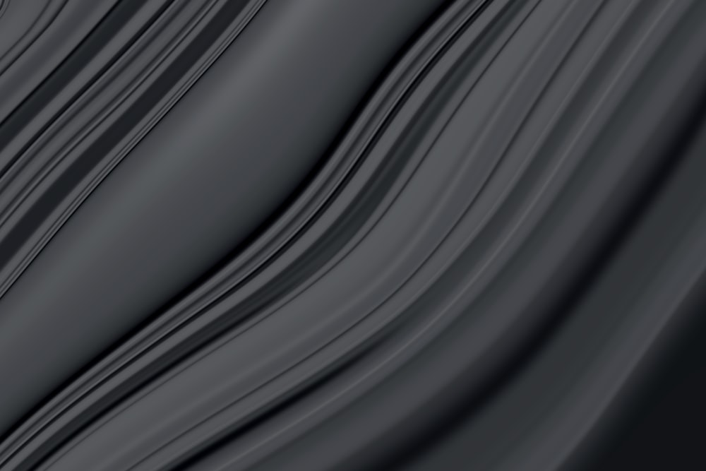 a close up of a black background with wavy lines