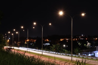 a city street at night with street lights