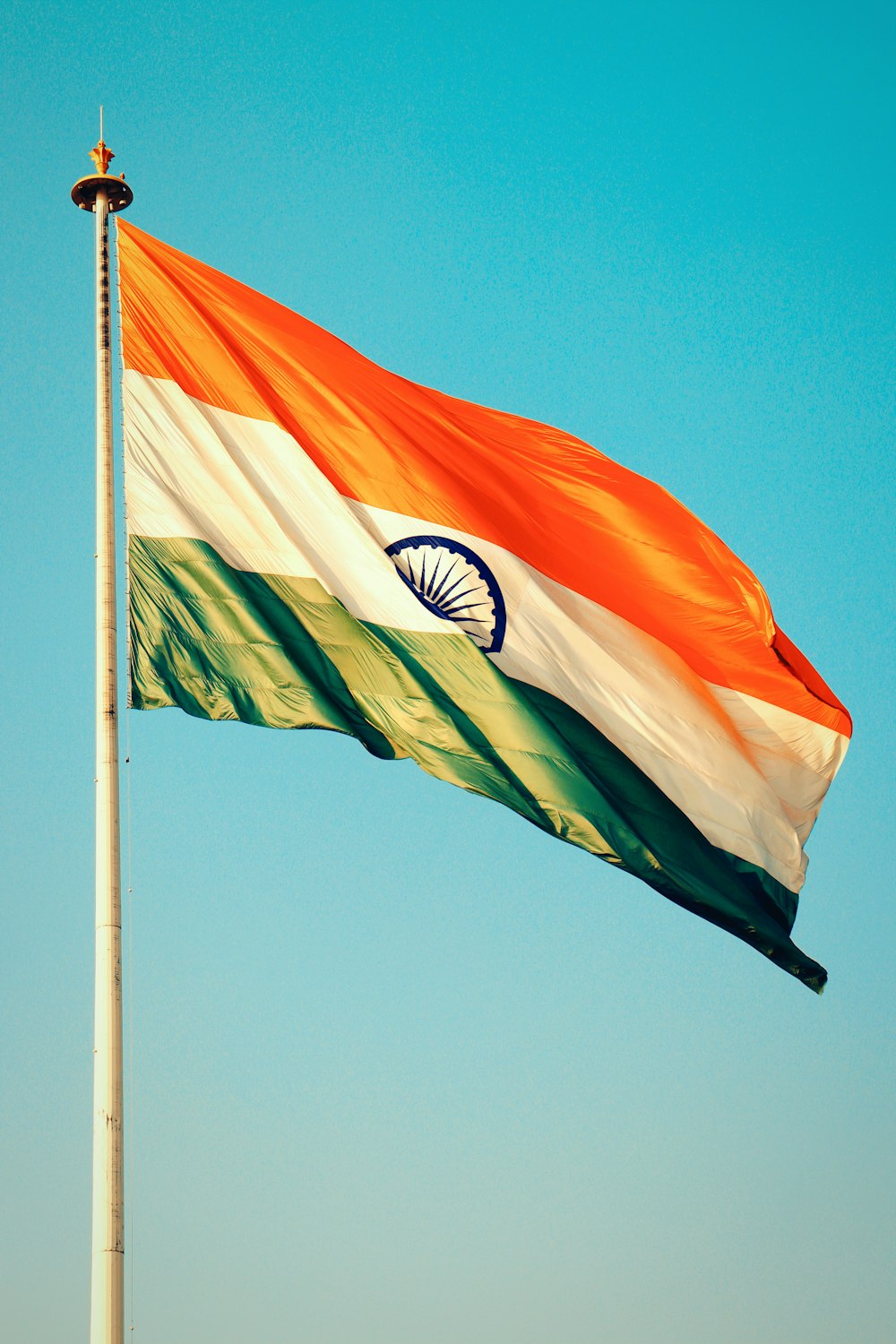 the indian flag is flying high in the sky