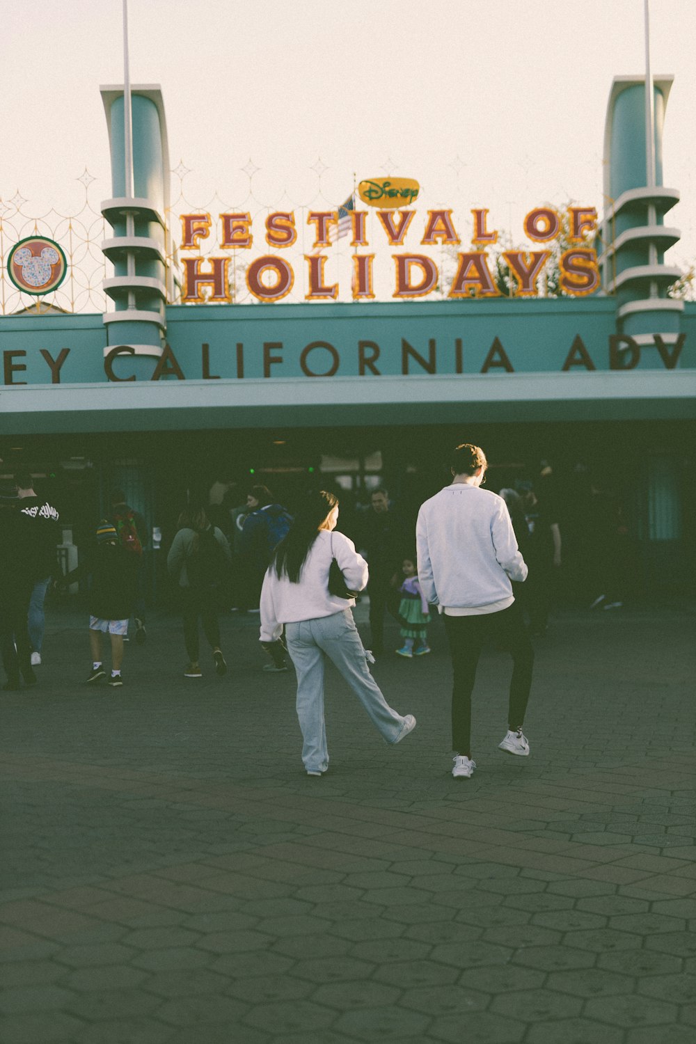 a couple of people standing in front of a building