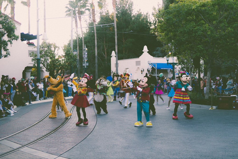 a group of people dressed in mickey mouse costumes