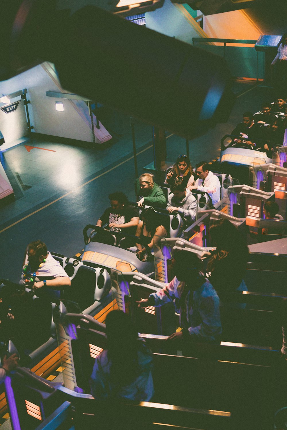 a group of people riding on top of a conveyor belt