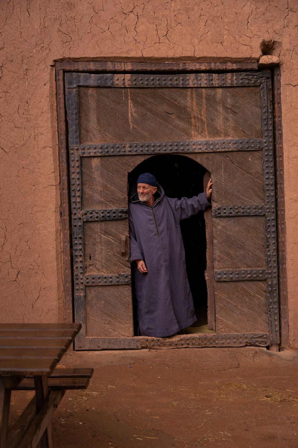 a man standing in a doorway of a building
