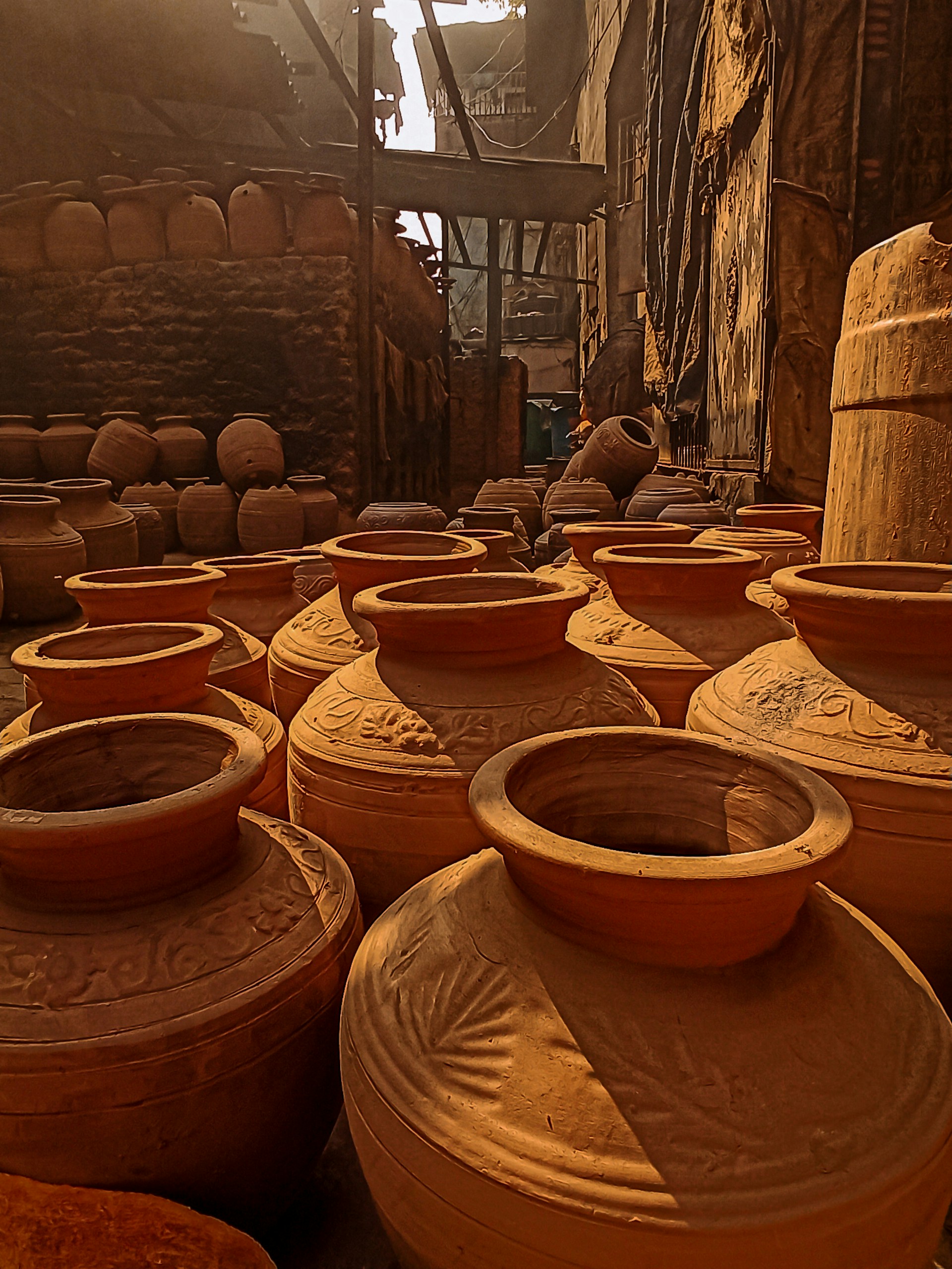 a group of clay pots sitting on top of a floor
