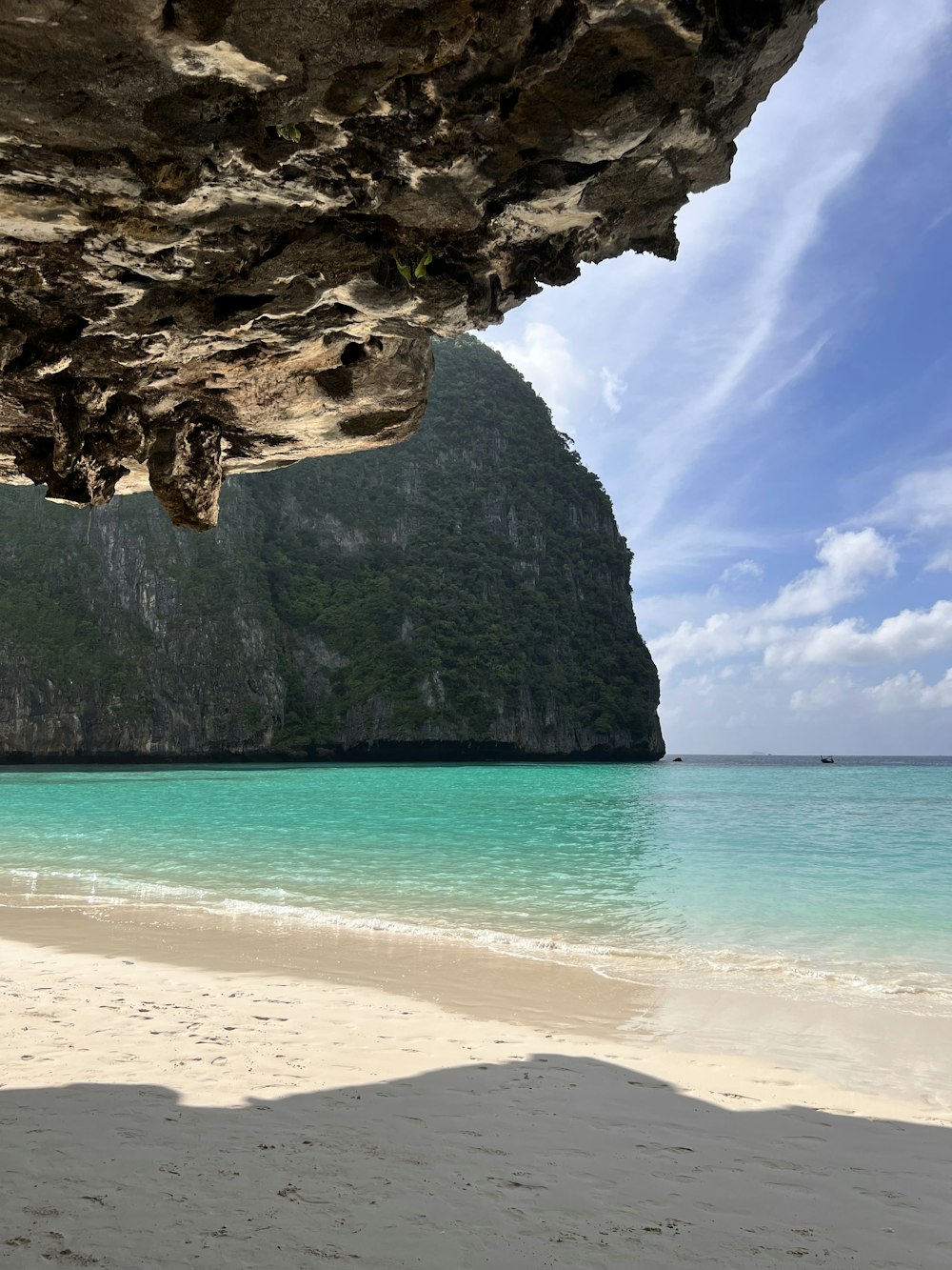 a view of a beach with a mountain in the background