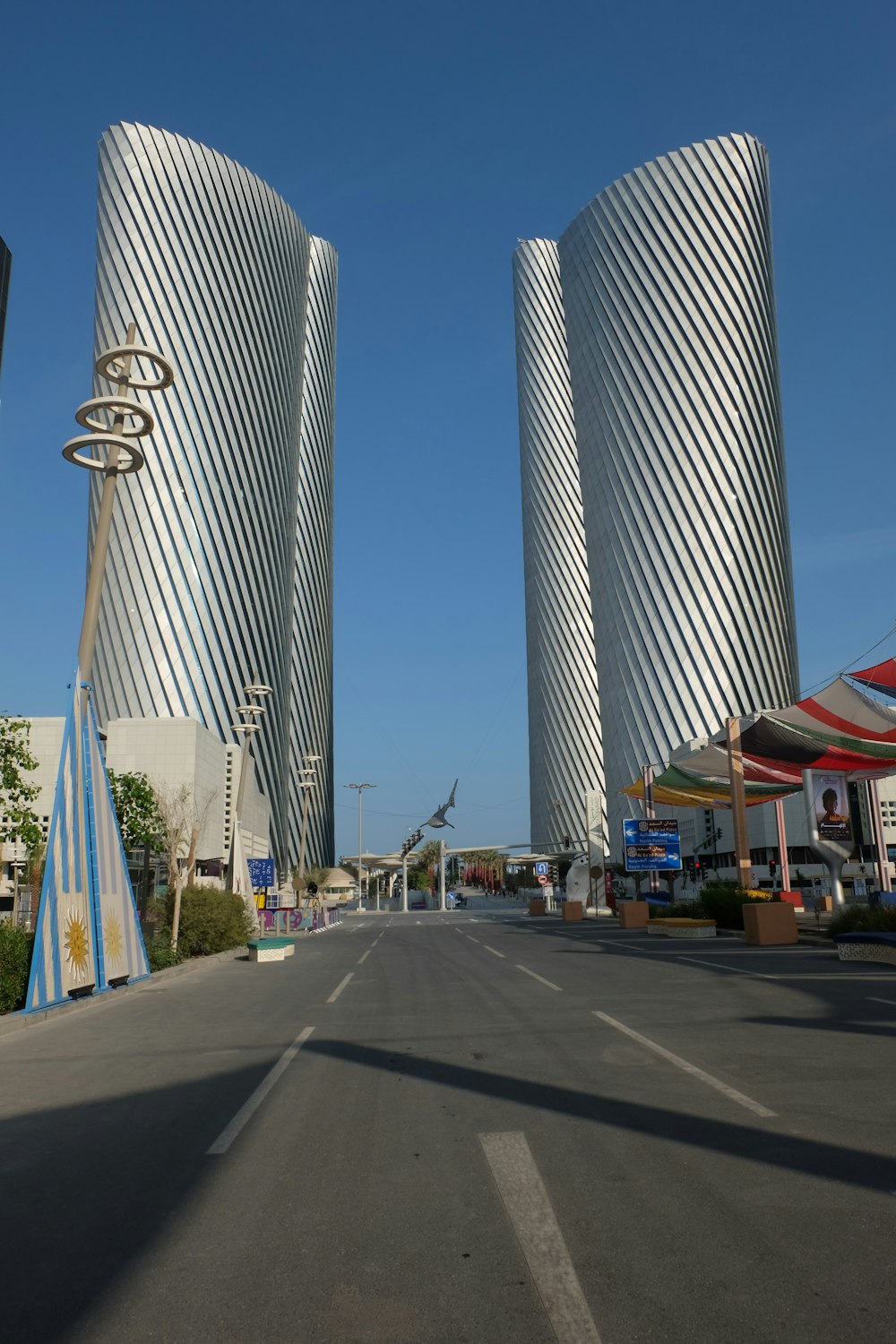 a street lined with tall buildings next to each other