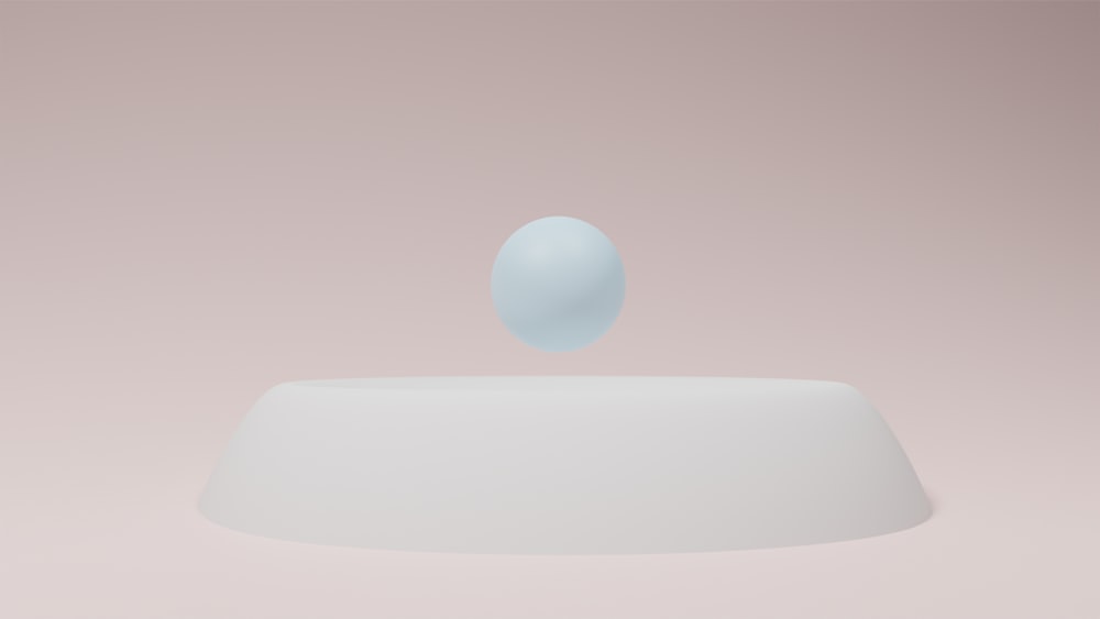 um objeto branco flutuando em cima de uma tabela