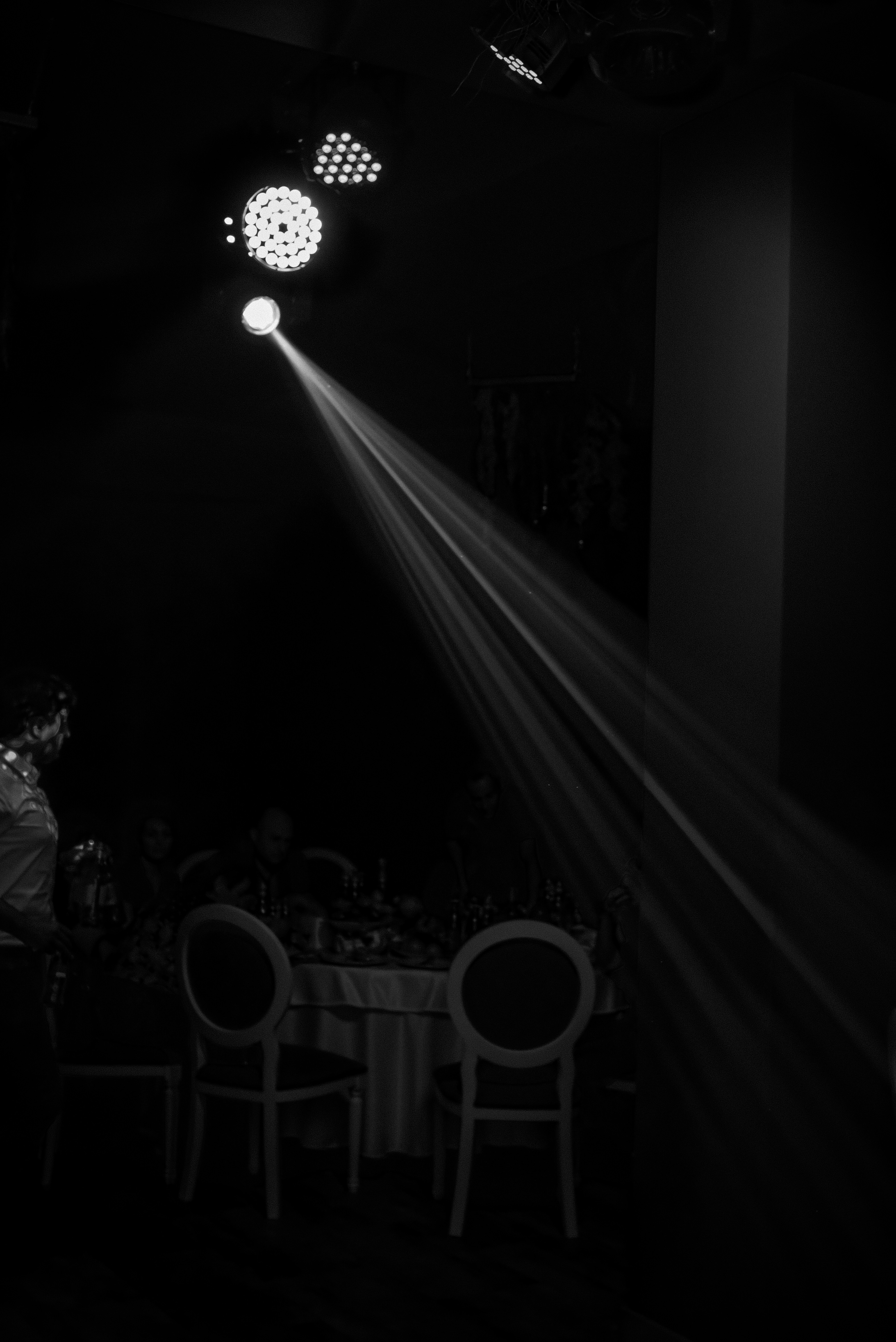 a black and white photo of a person in the dark