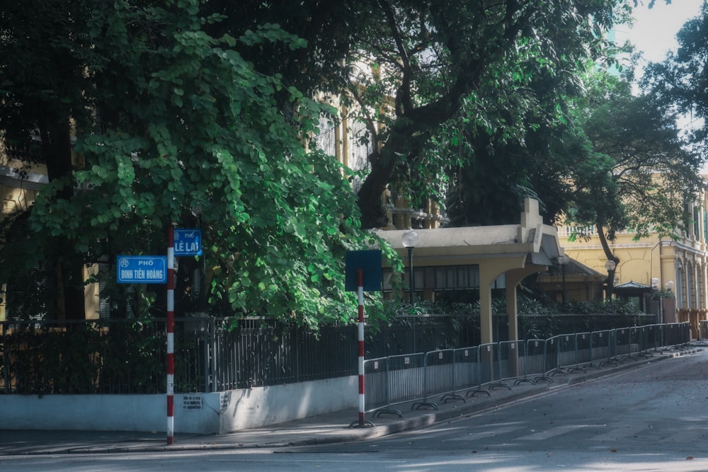 a street corner with a building and trees