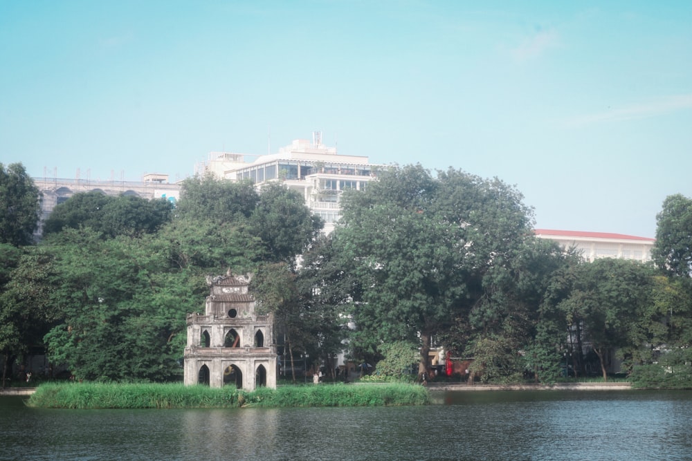 a large building sitting on top of a lush green field