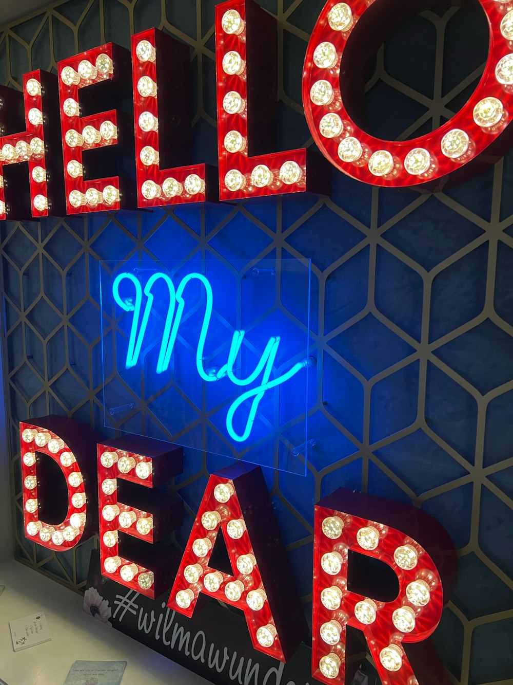 a neon sign that says hello my dear