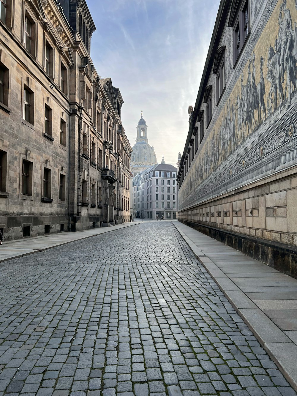 a cobblestone street in a european city