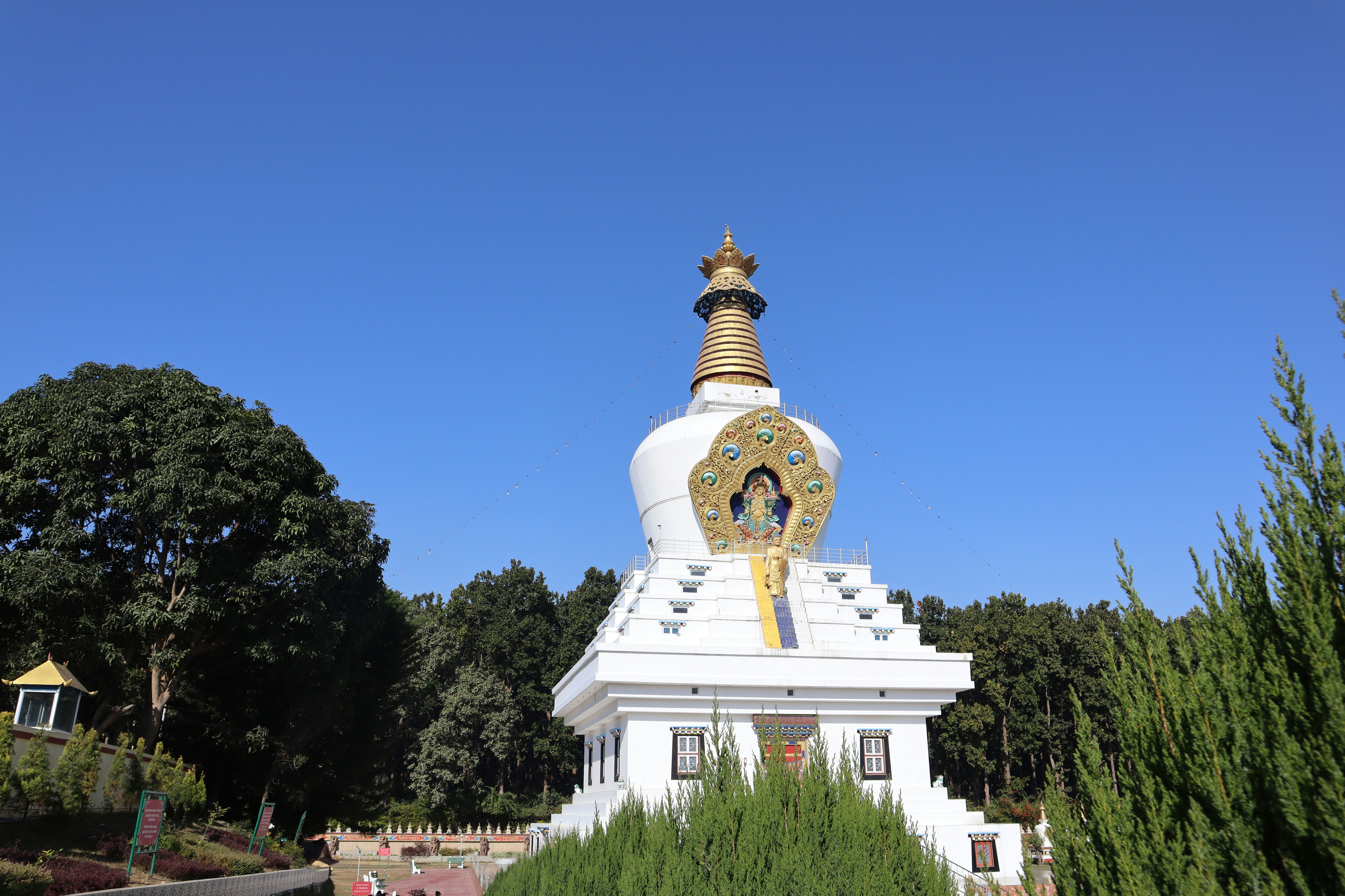 a white building with a gold and white decoration on top