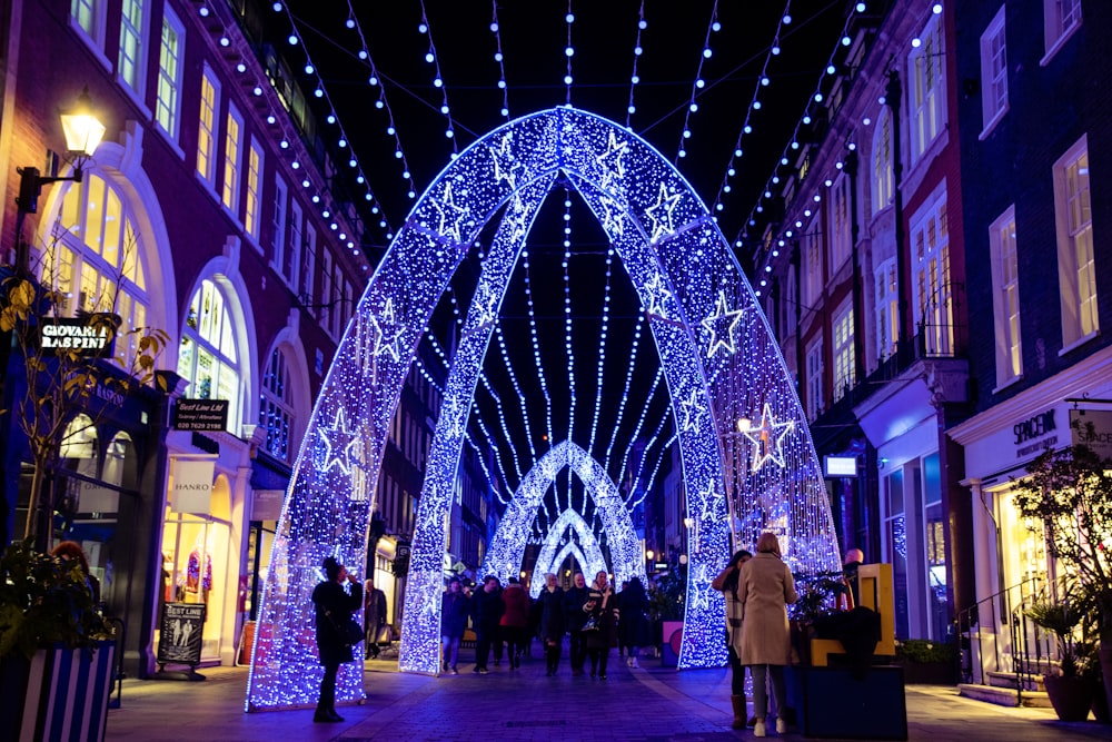 a large archway covered in blue christmas lights
