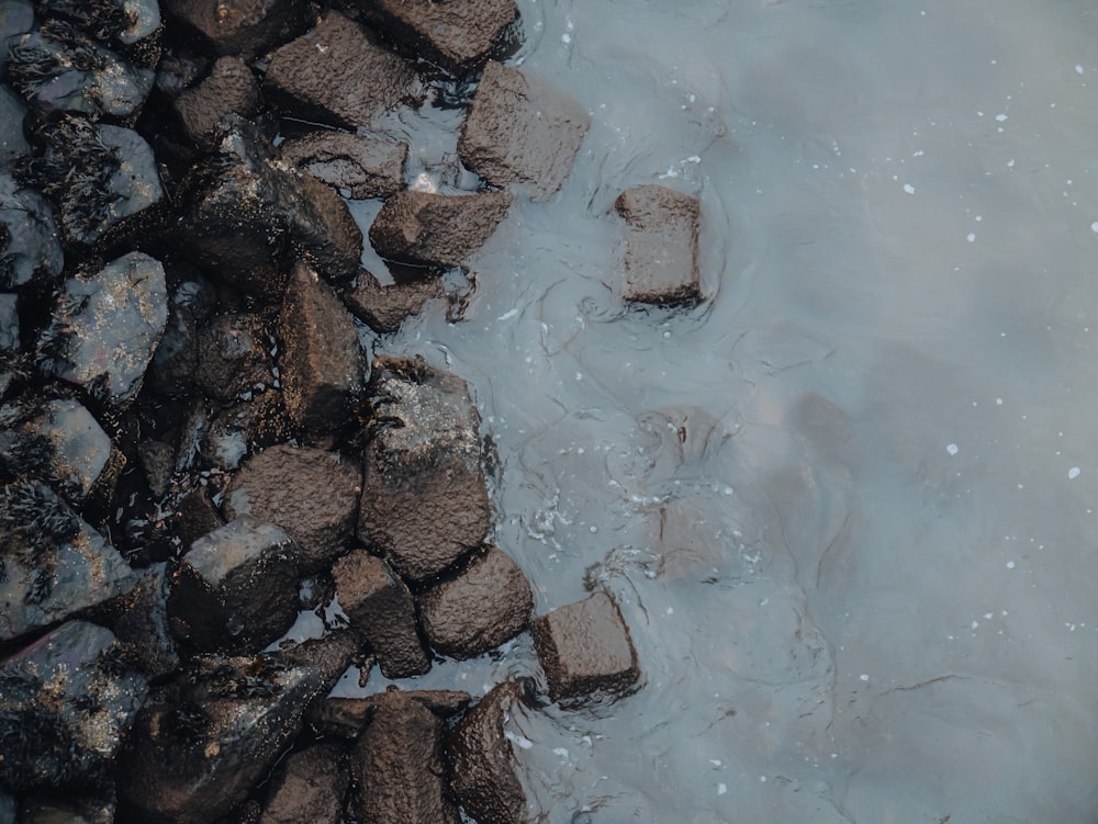 the rocks are in the water near the rocks