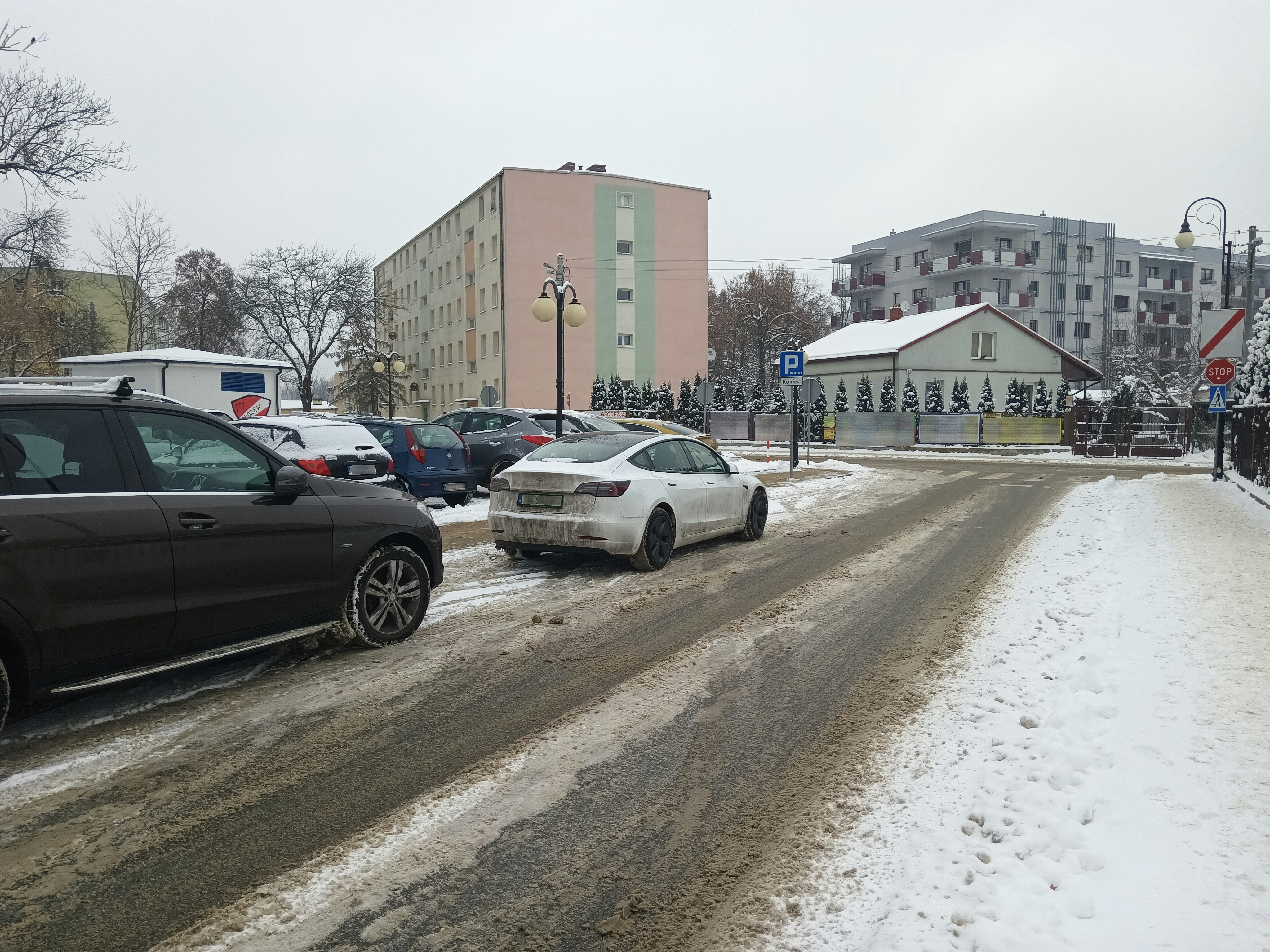 a couple of cars that are sitting in the snow