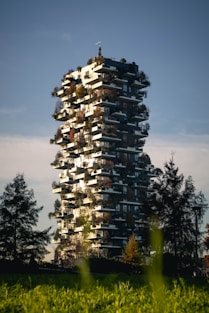 a tall building with lots of plants growing out of it