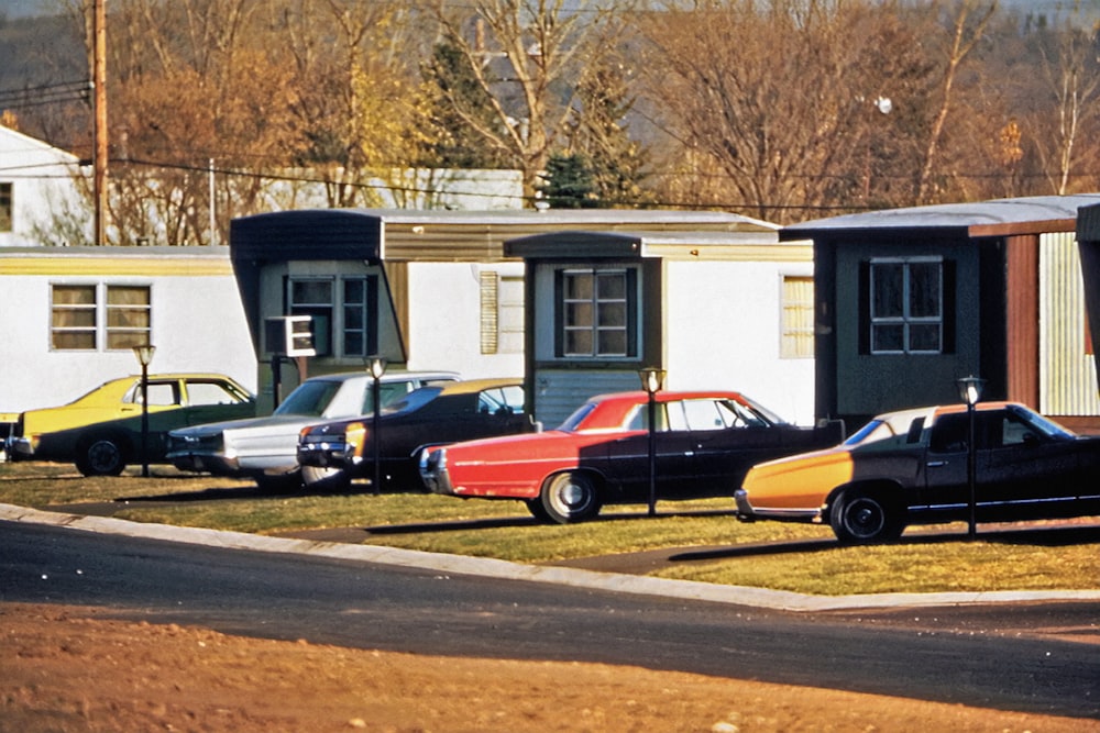 a group of cars parked in front of a house