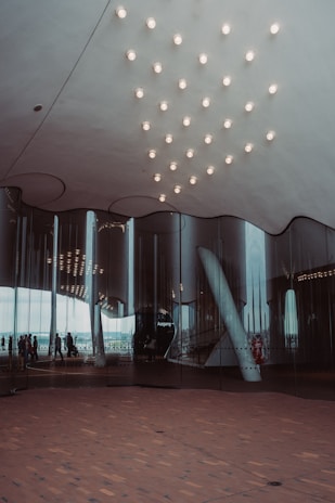 Close-up of a polished granite floor reflecting natural light in a modern office lobby