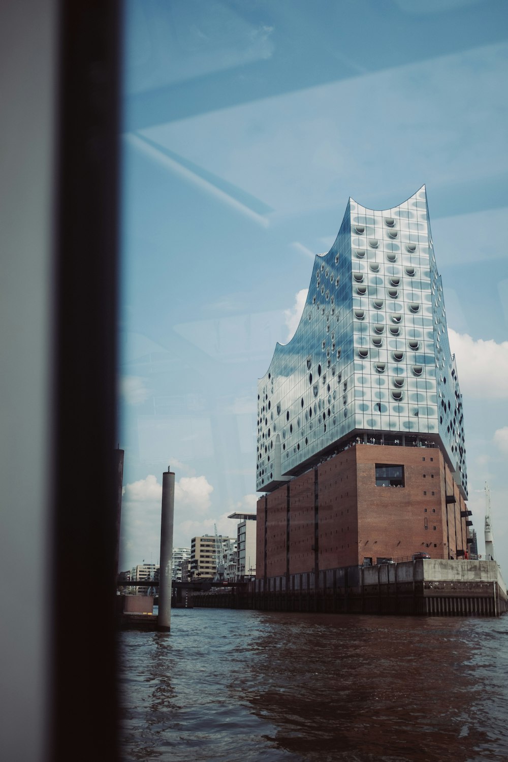 a tall building sitting on top of a body of water