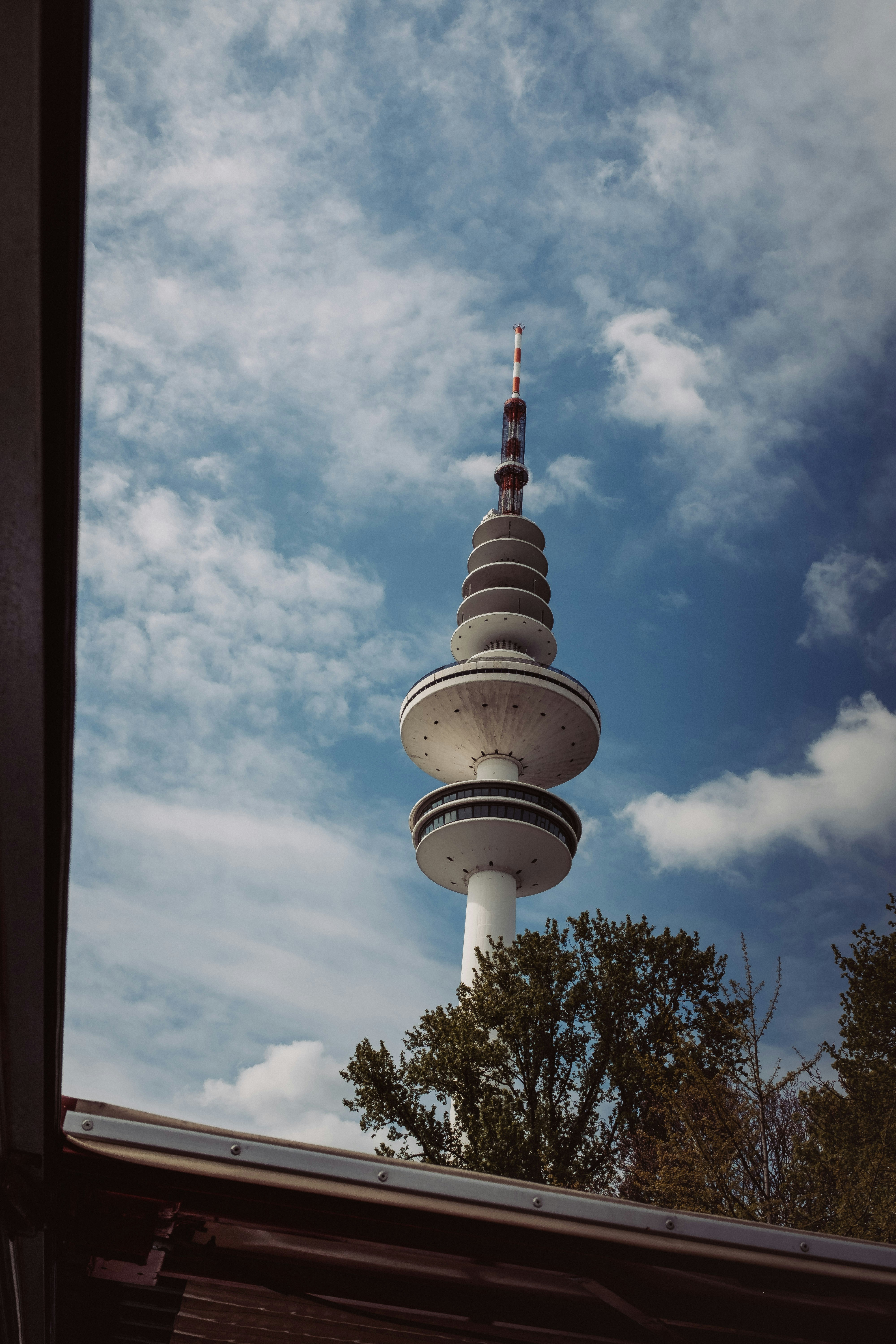 a very tall tower with a clock on it's side