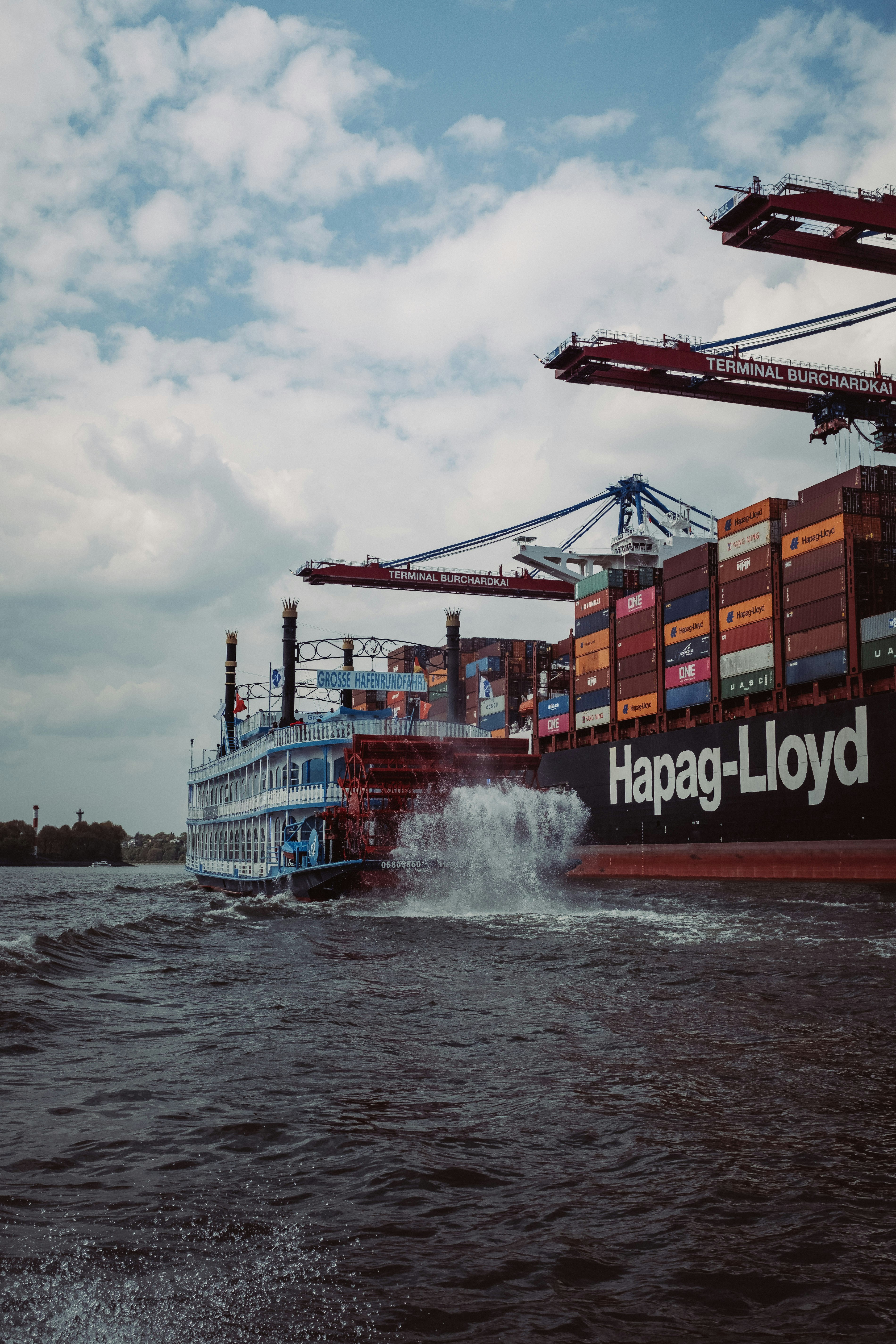 A large cargo ship in a body of water photo – Free Germany Image on ...