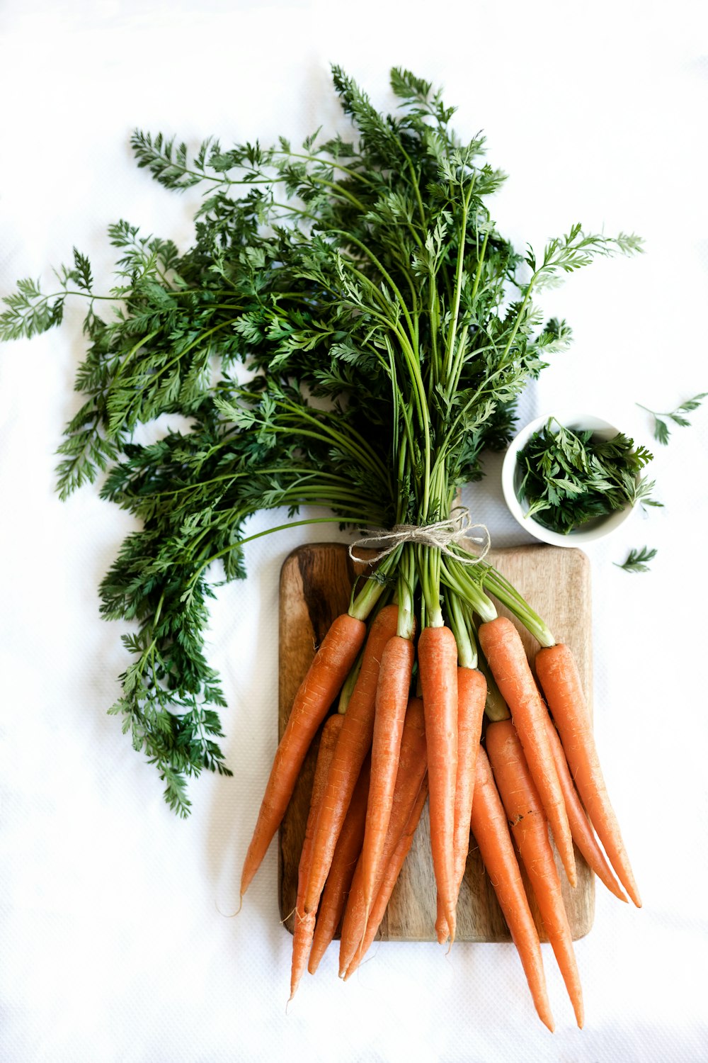 a bunch of carrots sitting on top of a cutting board