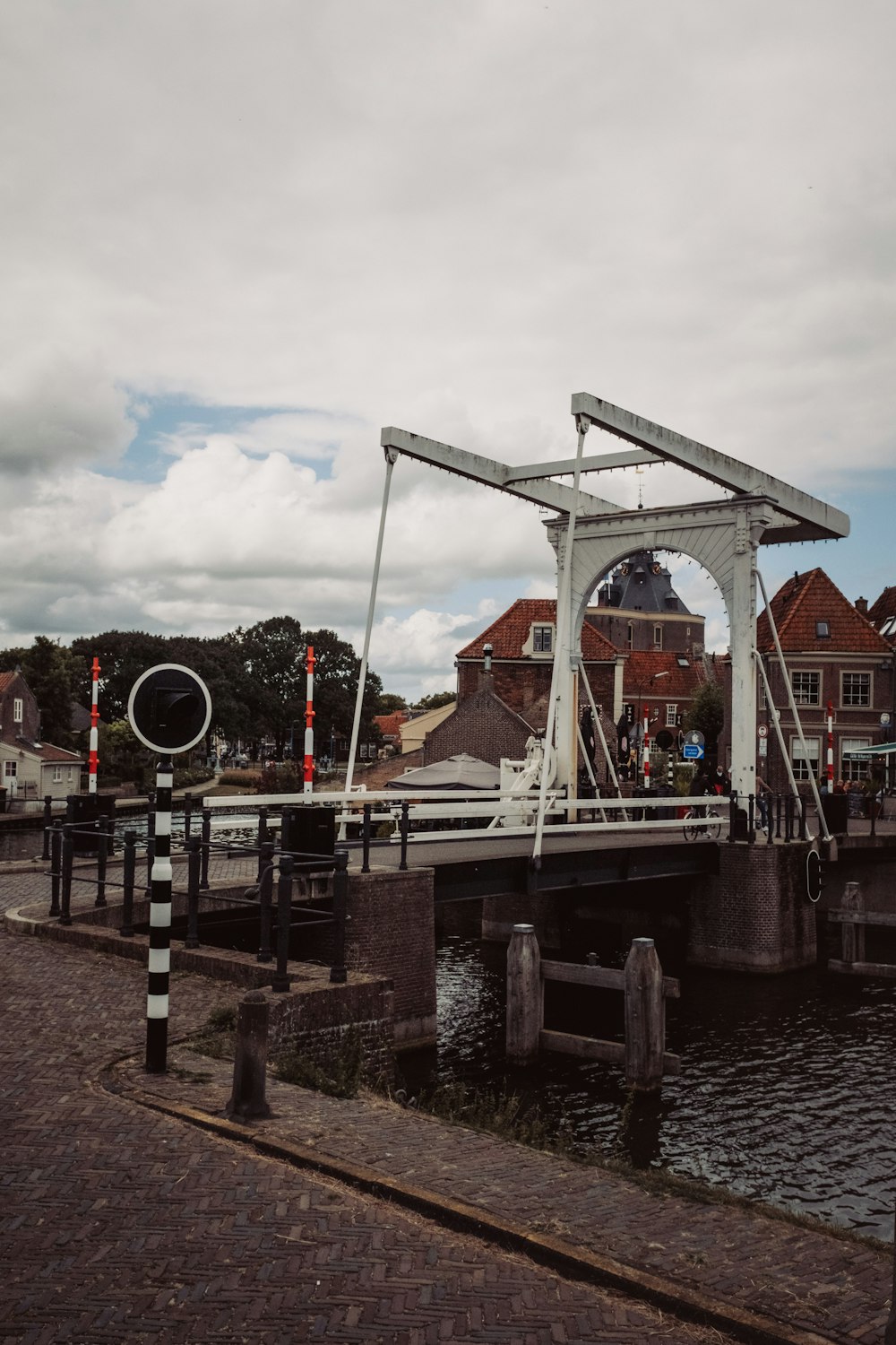 a bridge over a body of water with a sky background