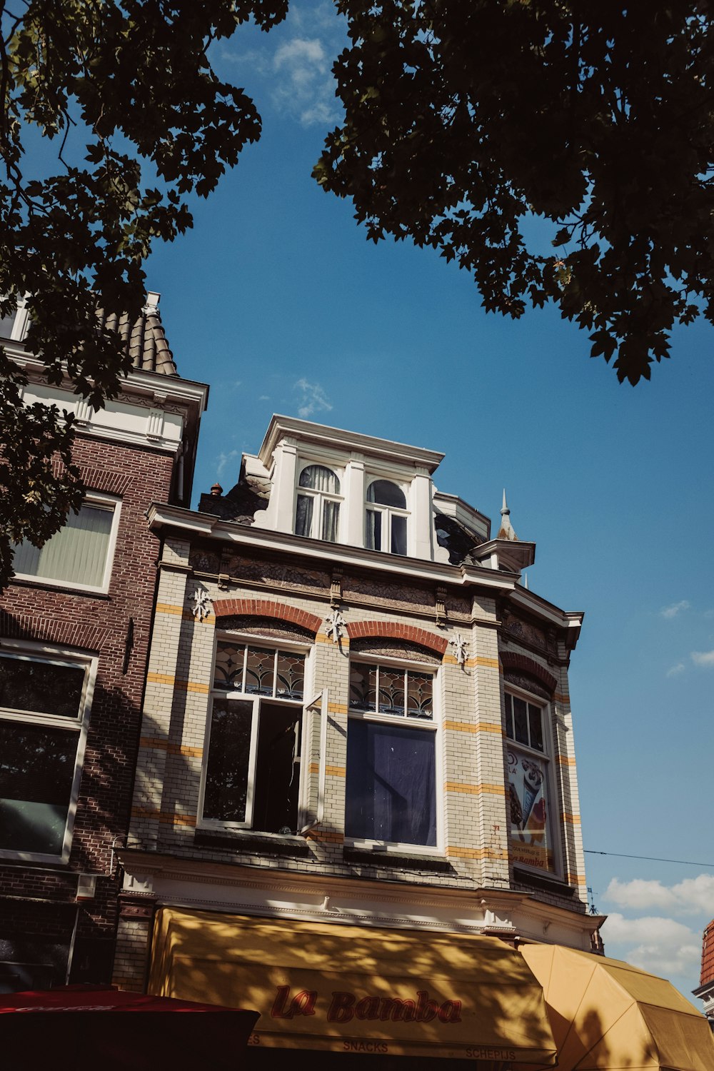 a tall brick building with a blue door