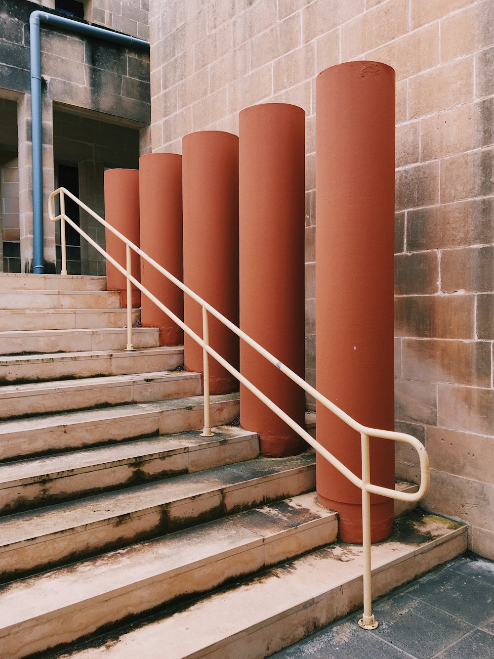 a set of stairs leading up to a brick building