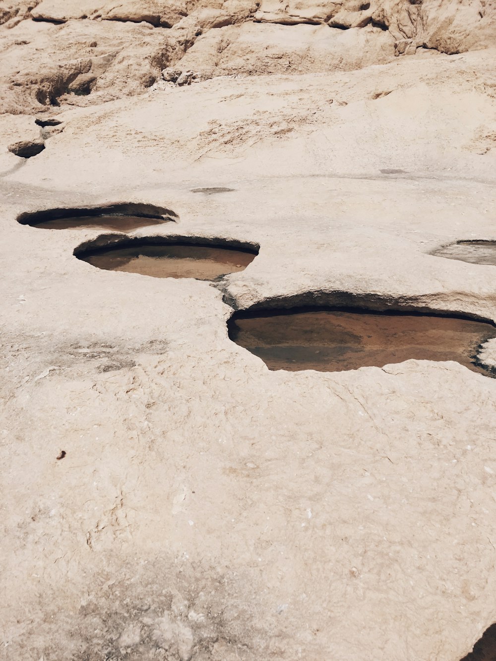 a group of rocks with holes in them