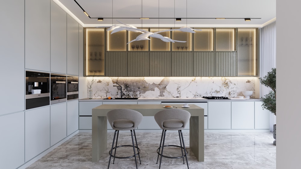 a modern kitchen with marble counter tops and stools