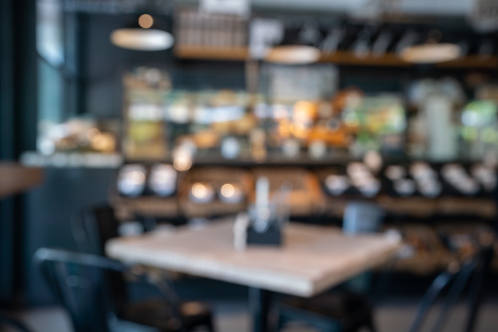 a blurry photo of a table and chairs in a restaurant