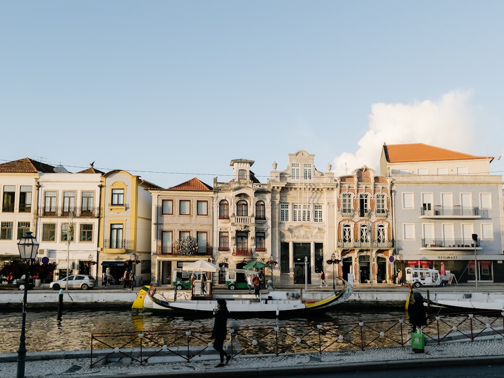 a row of buildings next to a body of water